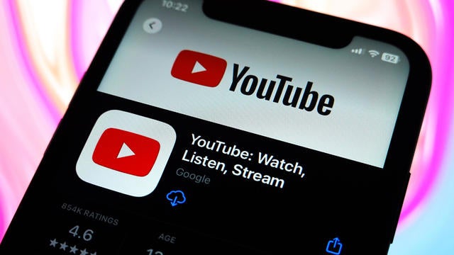 In this photo illustration, the YouTube logo is displayed in