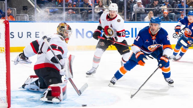 Leevi Merilainen #1 of the Ottawa Senators makes a save against Kyle Palmieri #21 of the New York Islanders during the first period at UBS Arena on January 14, 2025 in Elmont, New York. 